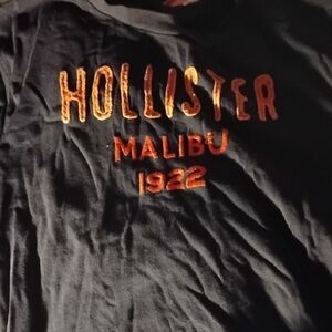 Hollister Black Tee with Vibrant Orange Text